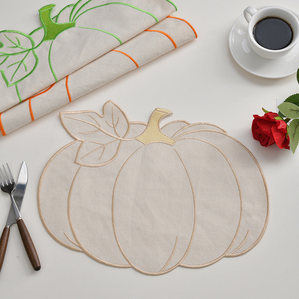 Seasonal table mat placemat made of linen in pumpkin silhouette with colorful embroidered border