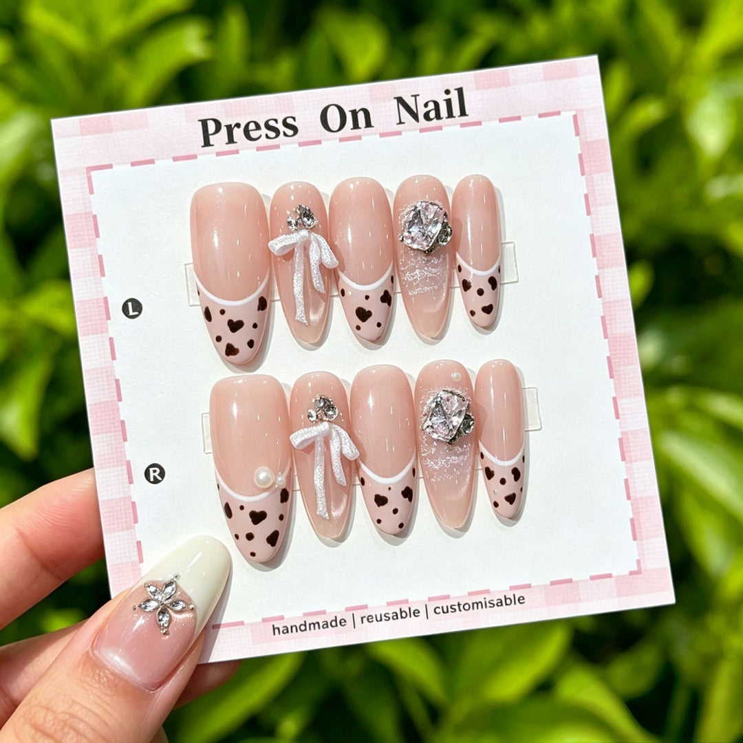 Artistic Press-On Nail Art Set with Cute Character and Bow Accents