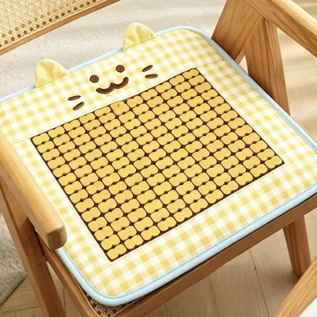 Padded seat cushion with massage stones and cat appliqué
