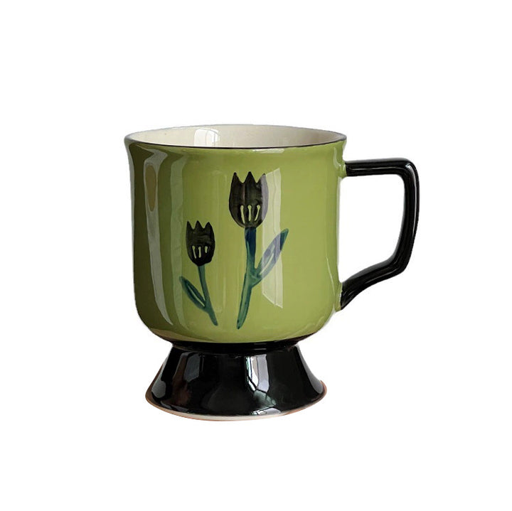 Ceramic cup with foot and hand-painted tulip motif