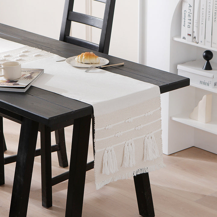 Woven cotton table runner with boho stripes, fringes, and textured woven edge Kalsten