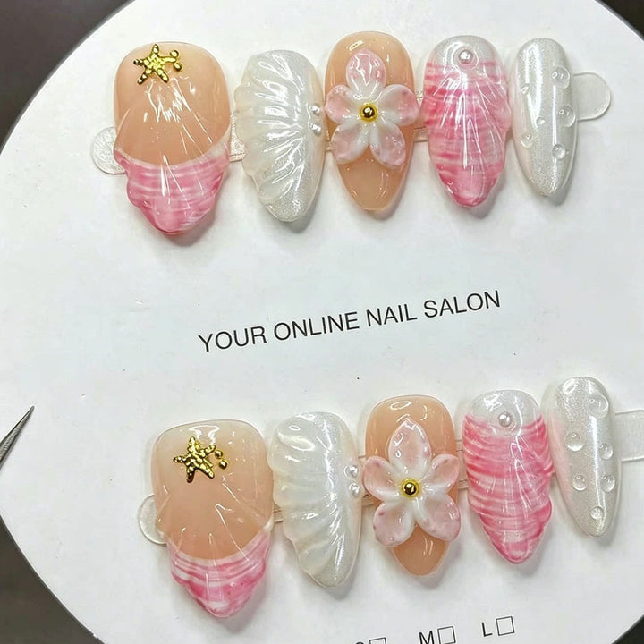 Art nail set with elegant floral decorations and glitter accents Kalsten