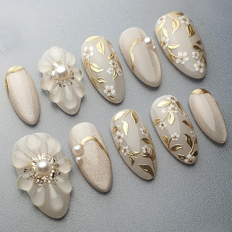 Acrylic nail set with elegant floral designs and glamorous glitter accents Kalsten
