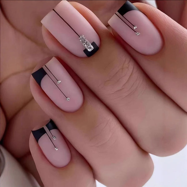Acrylic nail set with elegant rhinestone accents and stylish lines Kalsten