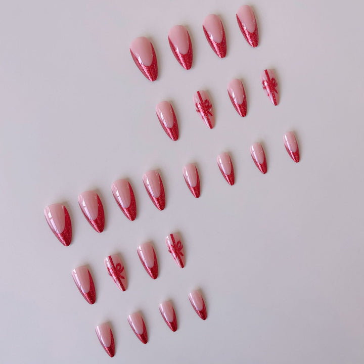 Nail set with glamorous glitter accents and bow design Kalsten
