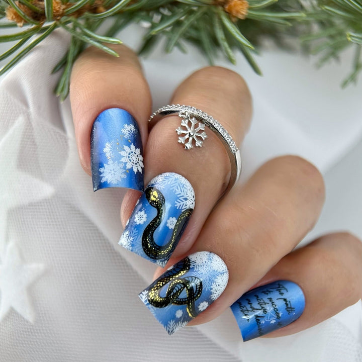Creative art nails with snowflake and snake motif Kalsten
