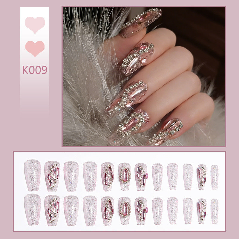 Glamorous artificial nails with sparkling rhinestone decorations Kalsten