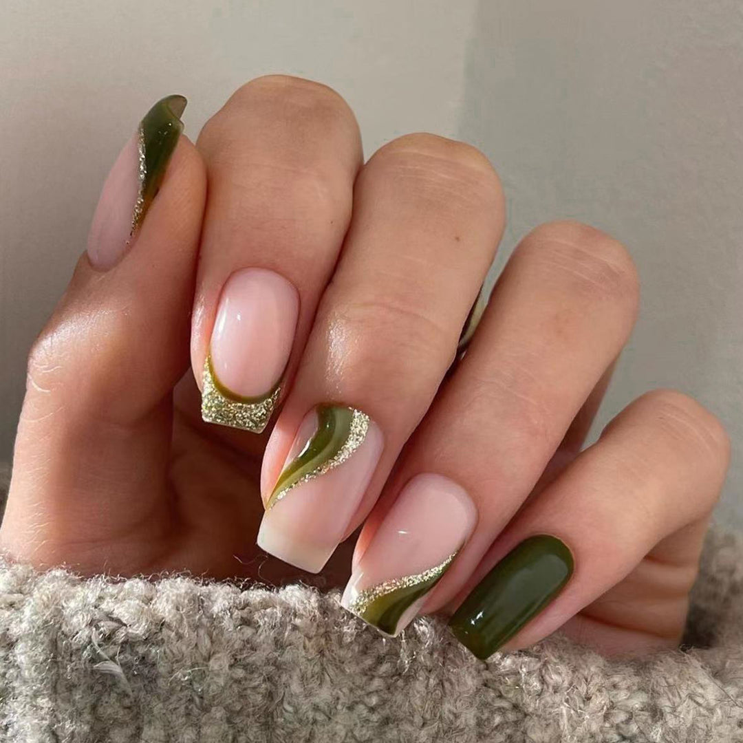 Artful nail extensions with golden accents and elegant design Kalsten