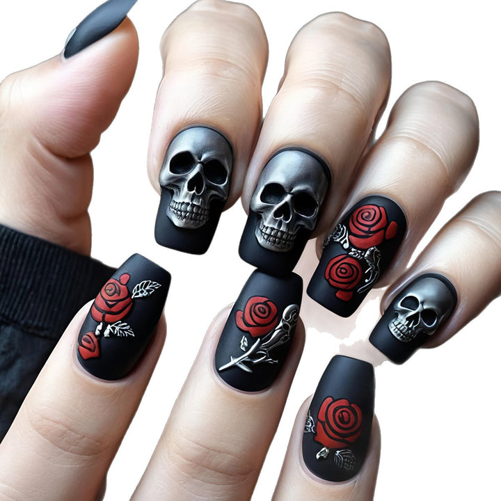 Creative nail art with skull and rose designs Kalsten