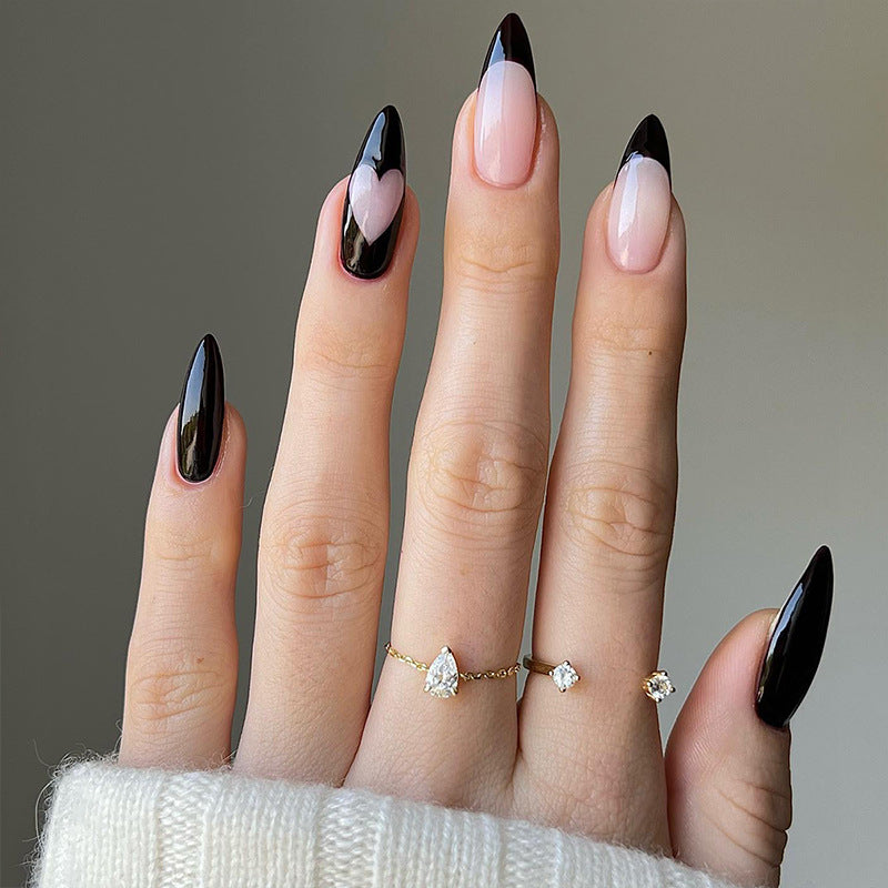 Artful stiletto nails with heart-shaped accents Kalsten