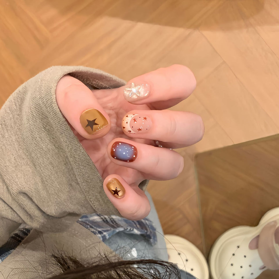 Artificial nails in modern design with star and gradient elements Kalsten