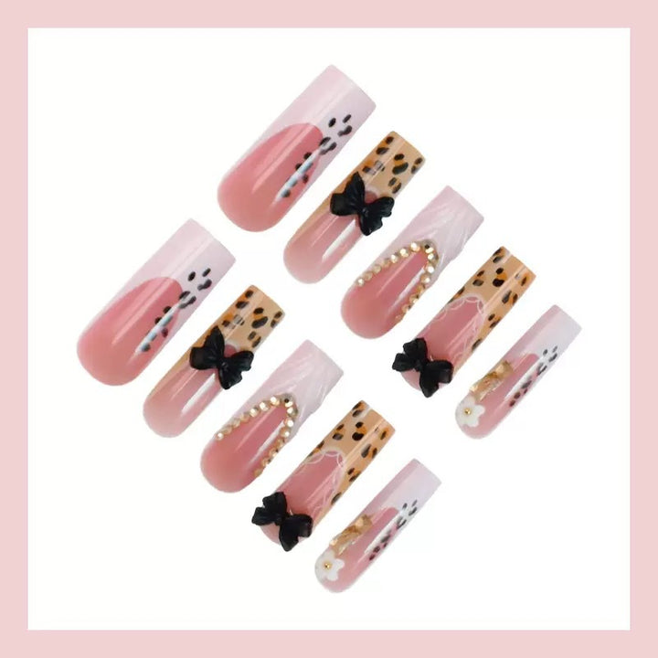Artistic Press-On Nail Design with Bow and Animal Print Accents Kalsten