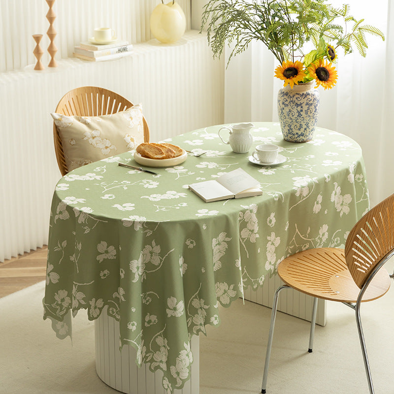 Round wipeable tablecloth with floral cut-out hem Kalsten