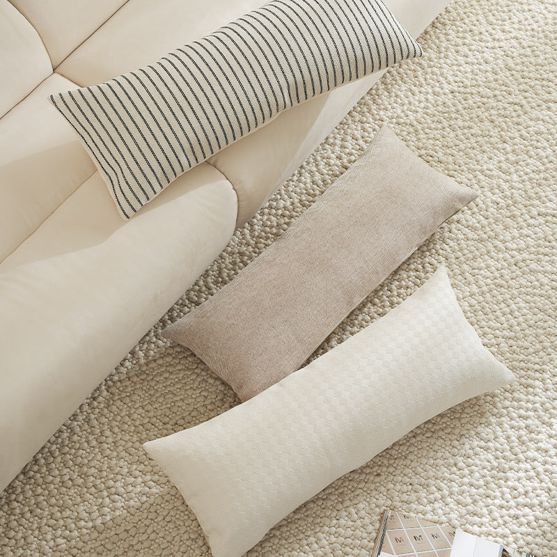 Long rectangular lumbar and neck pillow with textured woven look and concealed zipper Kalsten
