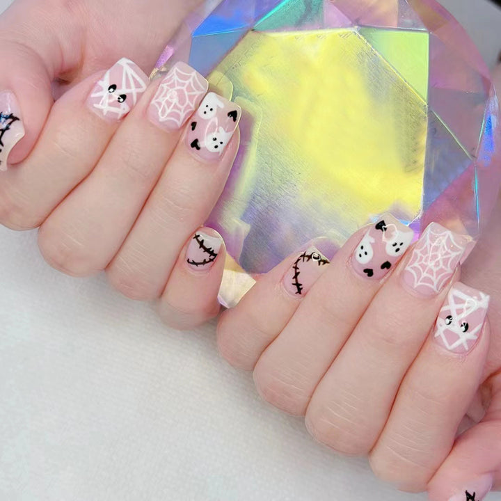 Halloween-Themed Ghost and Spider Nail Art