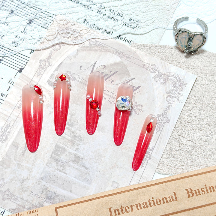 Artificial nails in elegant ombre style with glitter and jewelry accents Kalsten