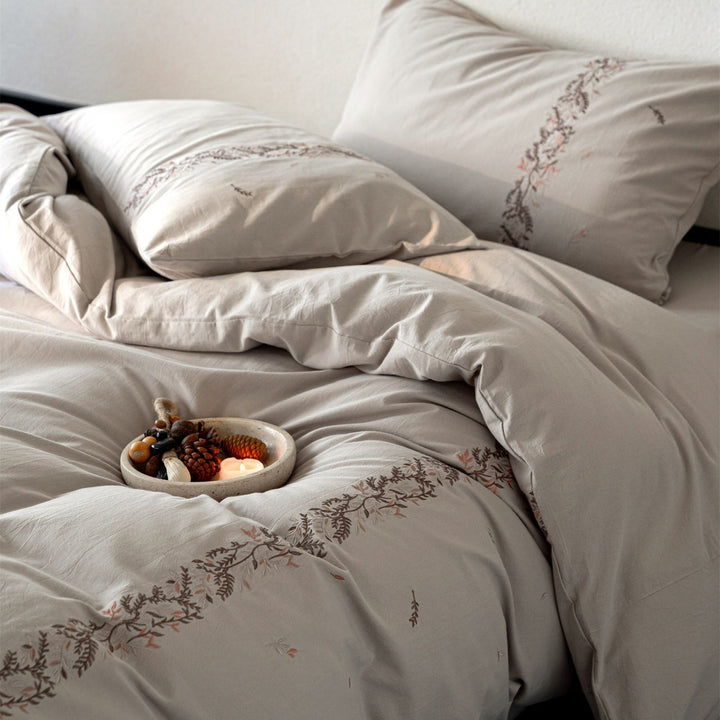 Embroidered cotton percale duvet cover set with fine floral border