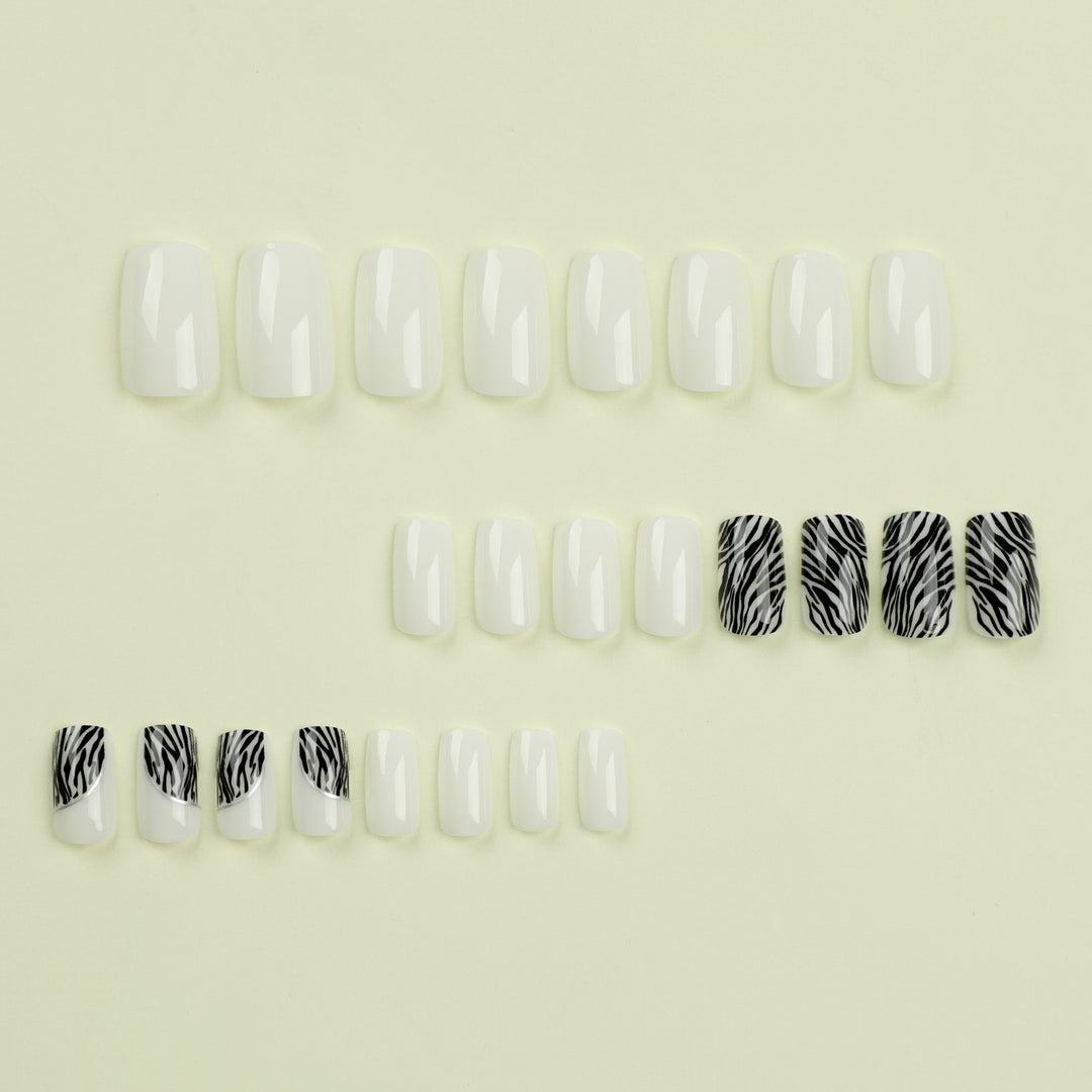 Artful nail extensions with stylish zebra pattern Kalsten