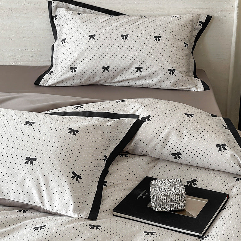 Luxurious cotton satin bedding set with butterfly motif and contrasting frame edge