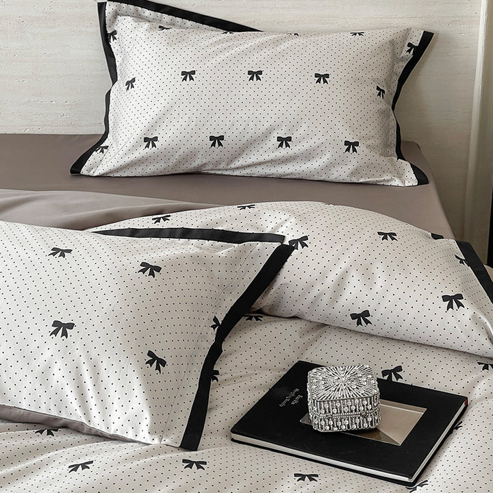 Luxurious cotton satin bedding set with butterfly motif and contrasting frame edge