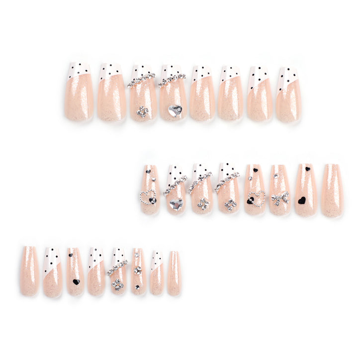 Artful nail extensions with elegant rhinestone and heart designs Kalsten