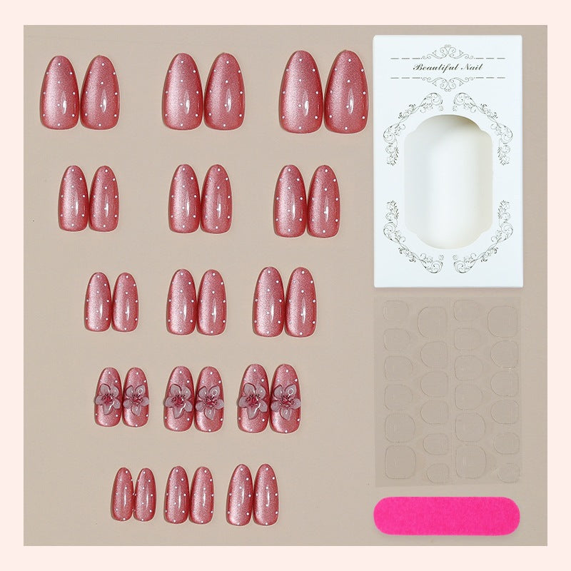 Artificial nail set with glamorous glitter design and floral accent Kalsten