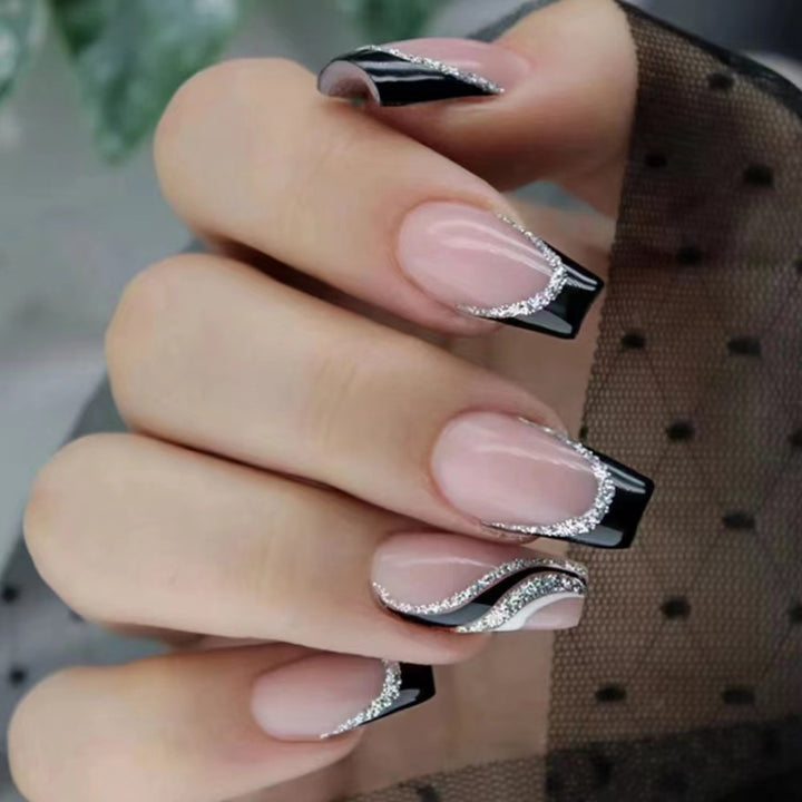 Elegant nail design with bow and rhinestone details Kalsten