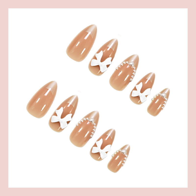 Artificial nail set with elegant bows and glitter details Kalsten
