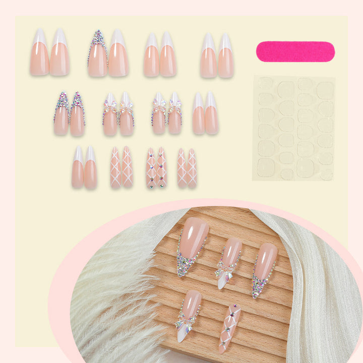 Acrylic nail set with luxurious rhinestone embellishments and bow accents Kalsten