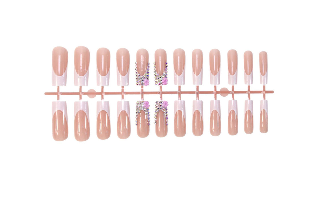 Art nail set with elegant glitter and floral accents Kalsten