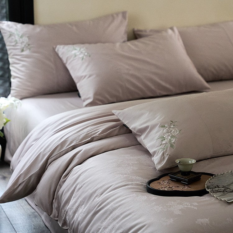 Luxurious satin bedding set with delicate floral embroidery