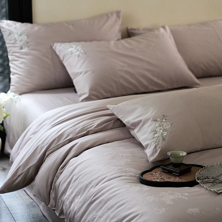 Luxurious satin bedding set with delicate floral embroidery