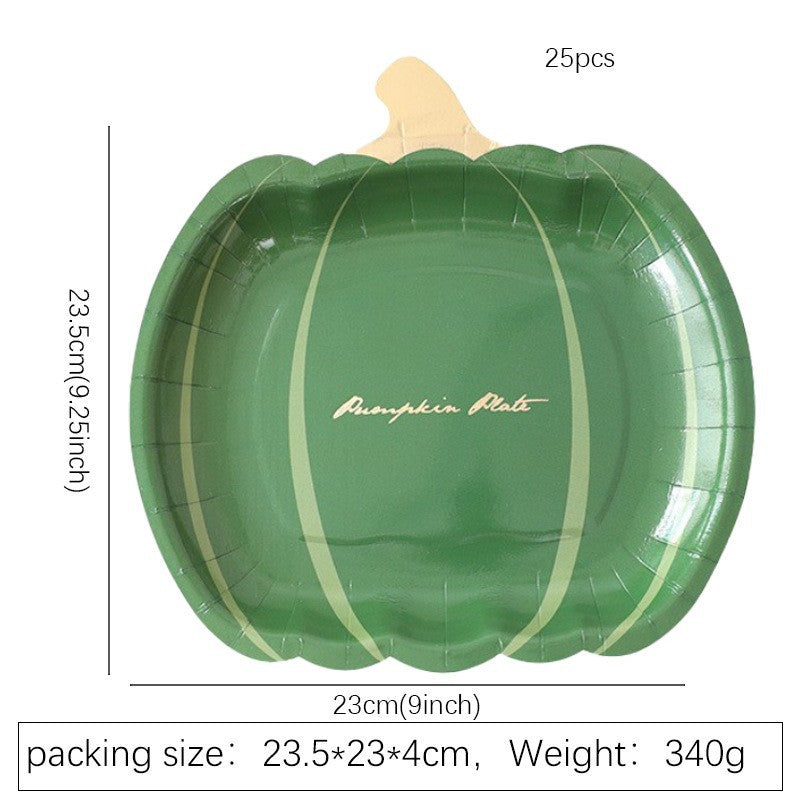 Disposable paper plates in pumpkin shape with spooky face design