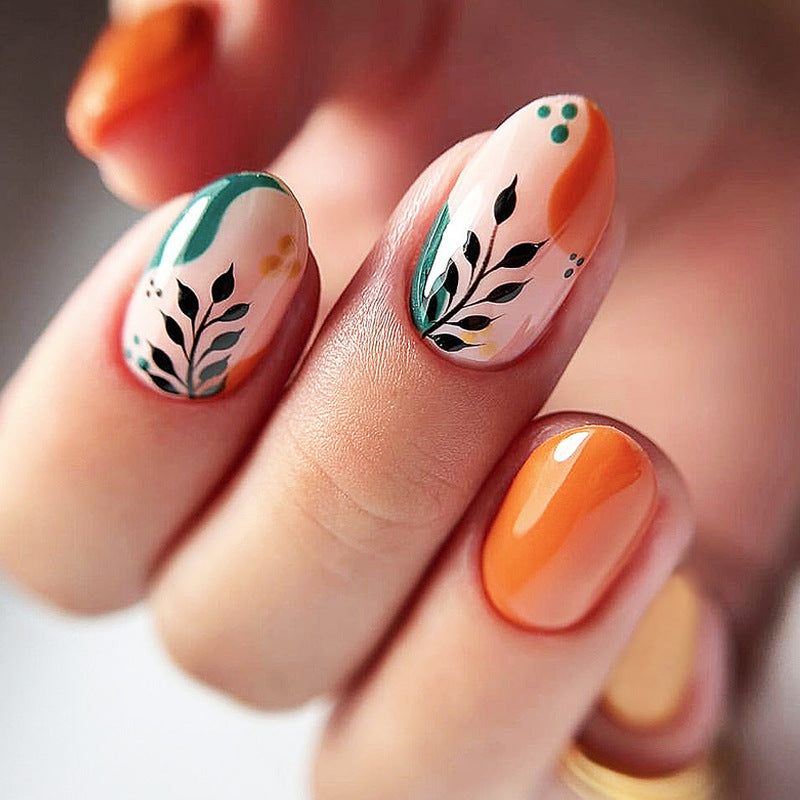 Artificial nail set with floral patterns and elegant glitter accents Kalsten
