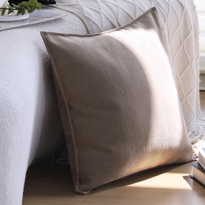 Square decorative cushion cover with hand-tufted ethnic appliqué motif and fringed edge Kalsten