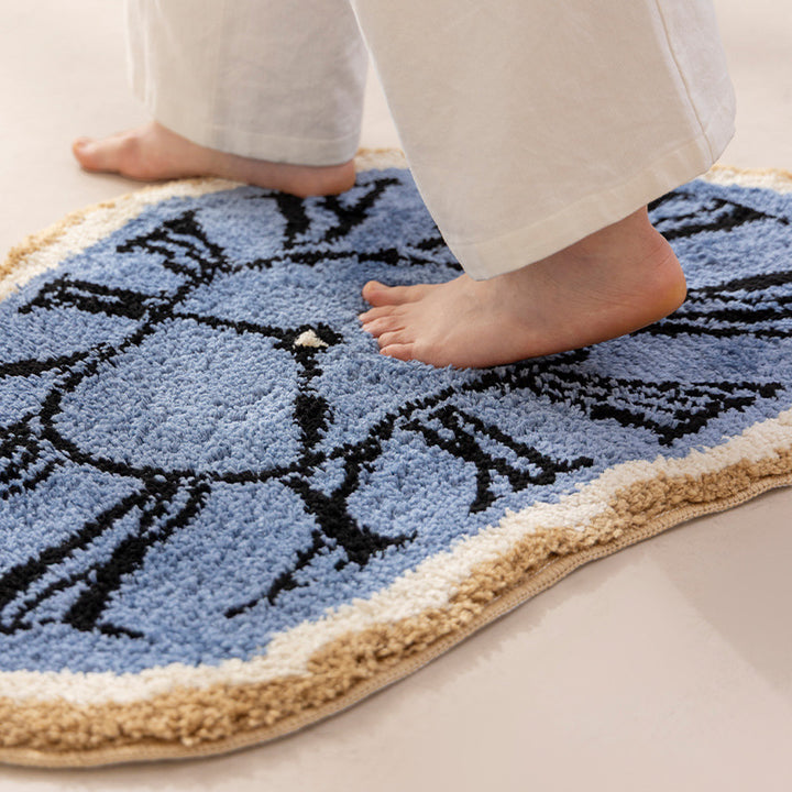 Decorative hand-tufted rug mat in organic clock shape Kalsten
