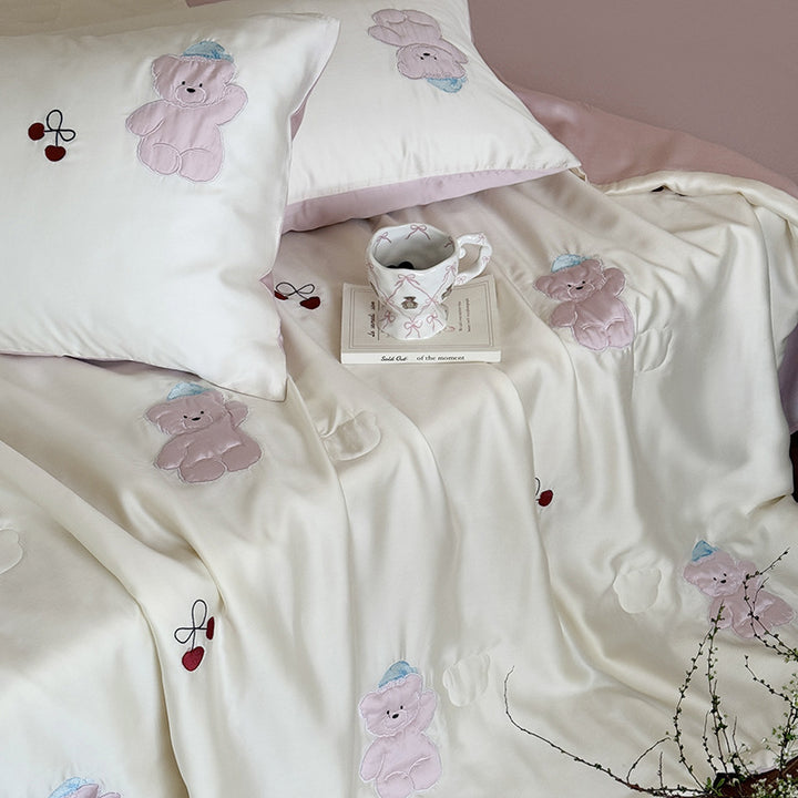 Satin bedding set with playful whale print and silky shiny surface
