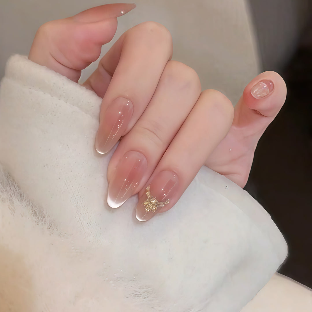 Artificial nails with elegant tip design and gold accents Kalsten
