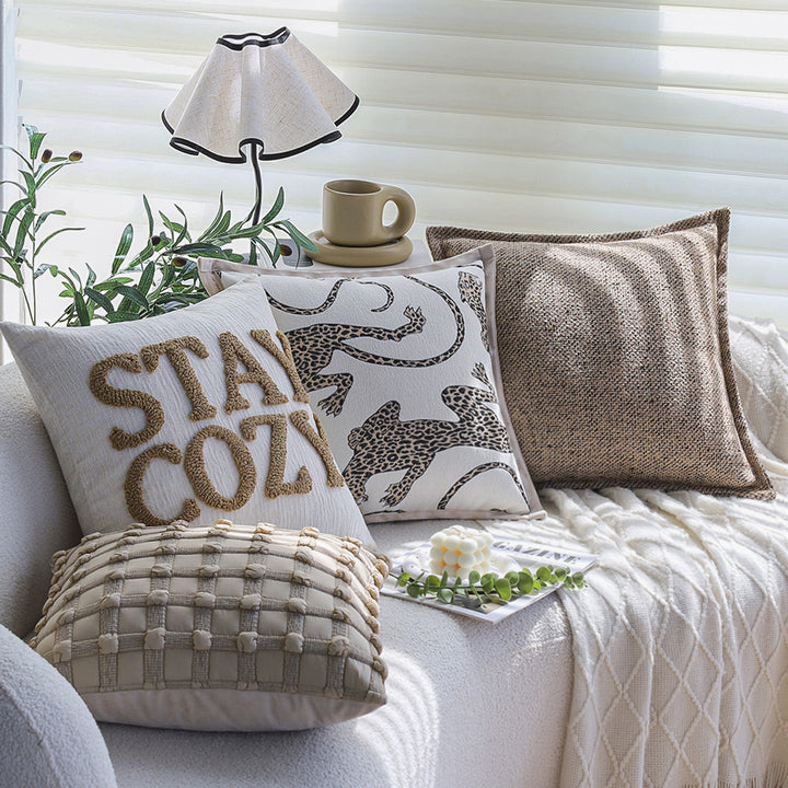 Square decorative cushion cover made of mottled boucle linen structure with fine piping Kalsten