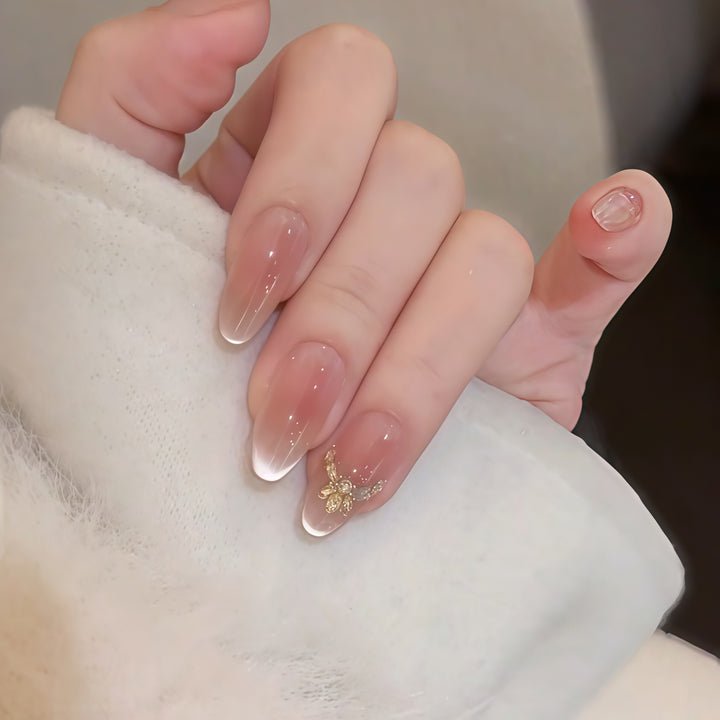 Artificial nails with elegant tip design and gold accents Kalsten