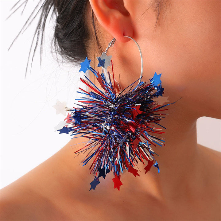 Women with eye-catching pompom hoops with lametta tassels and lightweight wire closure Kalsten