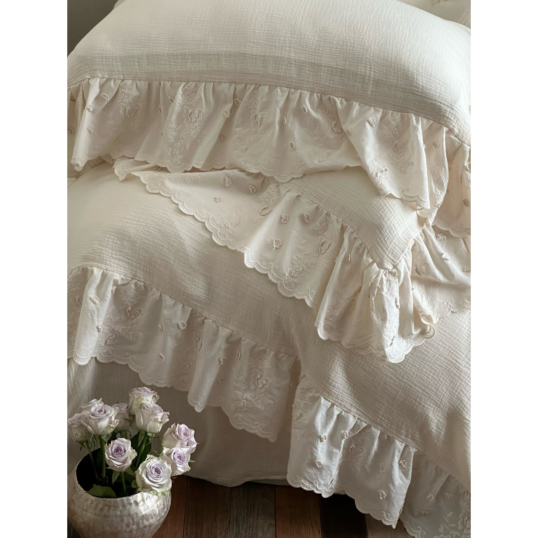 Quilted cotton duvet with embroidered frill and layered ruffled bed skirt