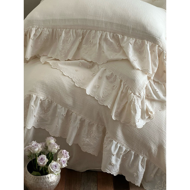 Quilted cotton duvet with embroidered frill and layered ruffled bed skirt