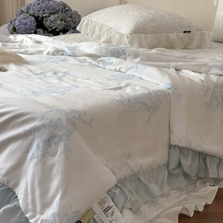 Quilted bedspread with ruffle and reversible satin bedding set