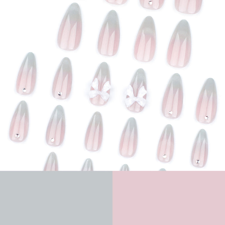 Elegant Stiletto Nails with Glitter and Bow Accents Kalsten