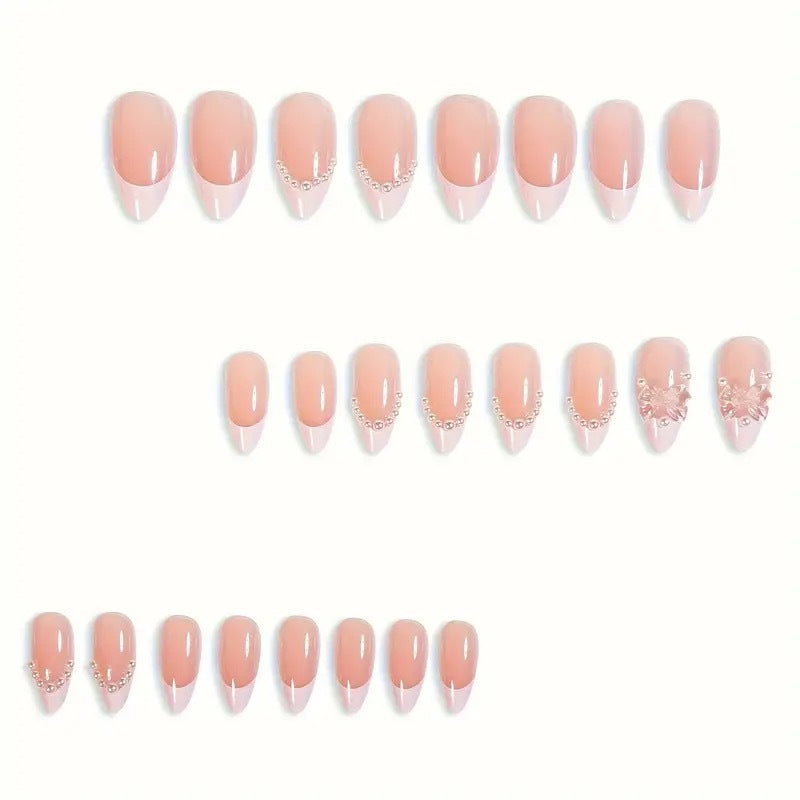 Art nail tips with delicate pearl and butterfly accents Kalsten