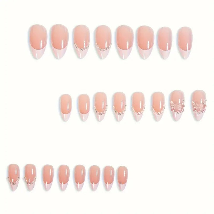 Art nail tips with delicate pearl and butterfly accents Kalsten