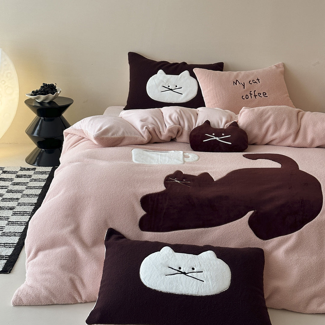 Cozy bedding set with embroidered cat appliqués and soft fleece surface