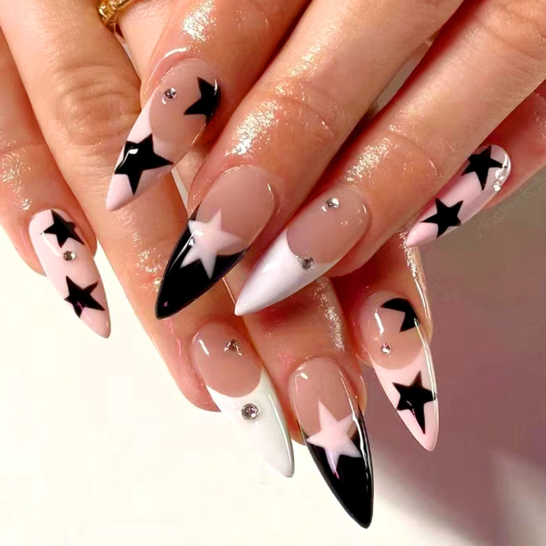 Artistic stiletto nails with star motif Kalsten