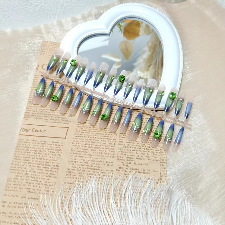 Artificial nails with elegant gradient color and glitter accents Kalsten